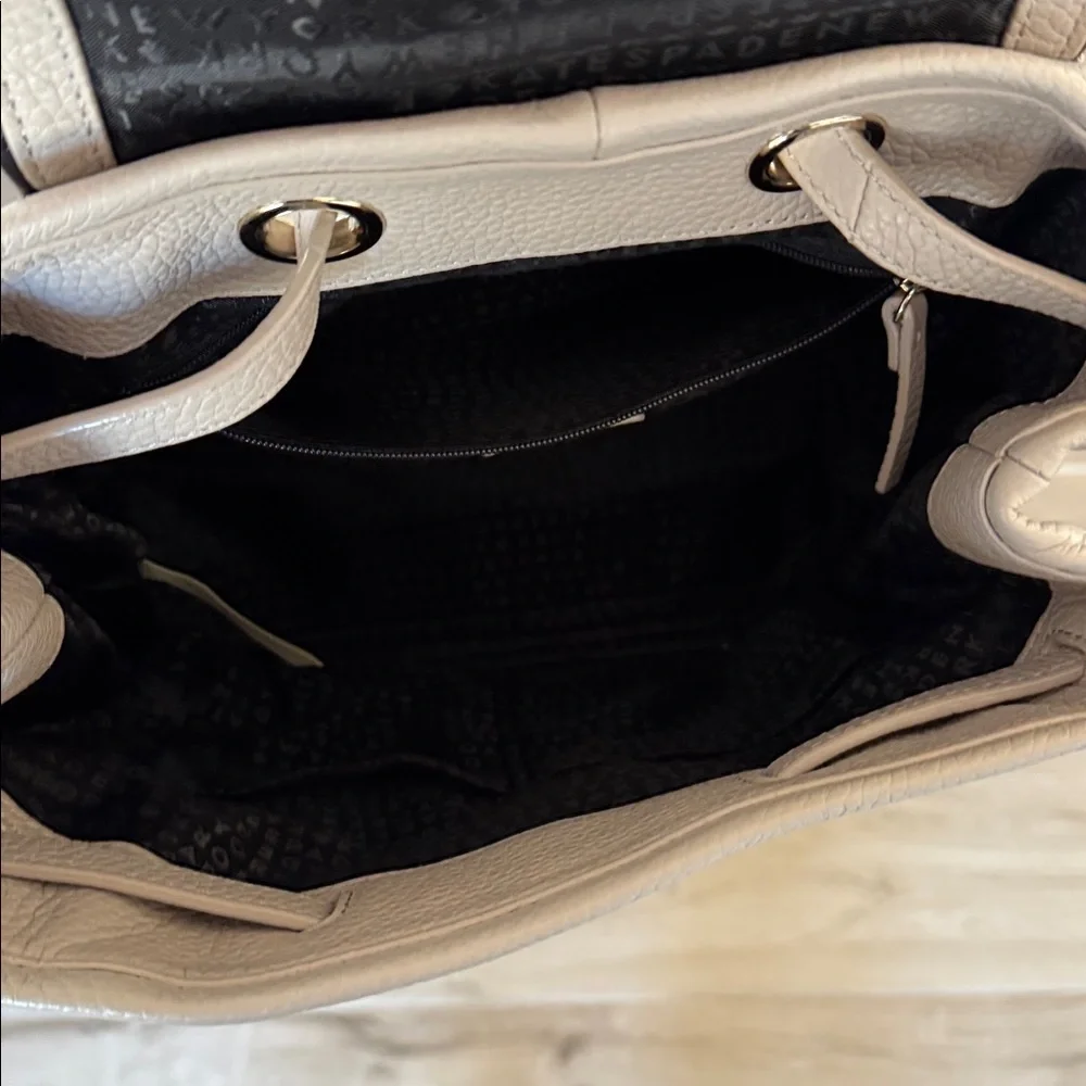 Kate Spade Chester Street Kacy Moussefrost with black accent and tassel backpack
